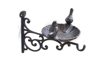 Side view of cast iron bird bath with wall mounted bracket