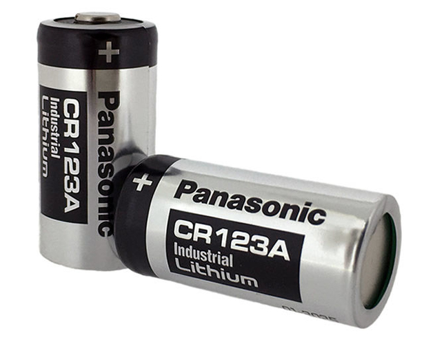CR123A Panasonic battery next to a ruler for size reference