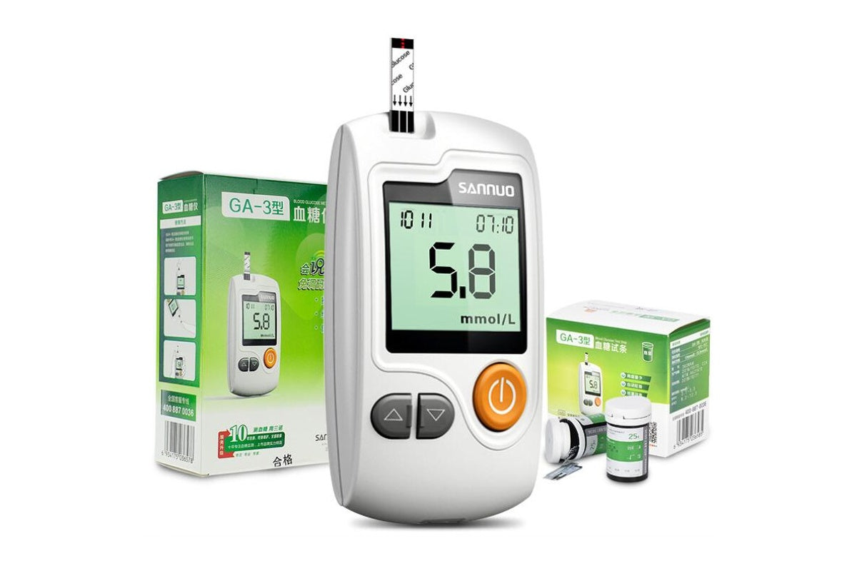 Close up of glucose meter test strip slot and buttons