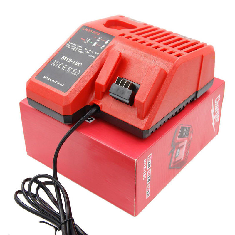 Battery and charger set placed on a wooden workbench in workshop