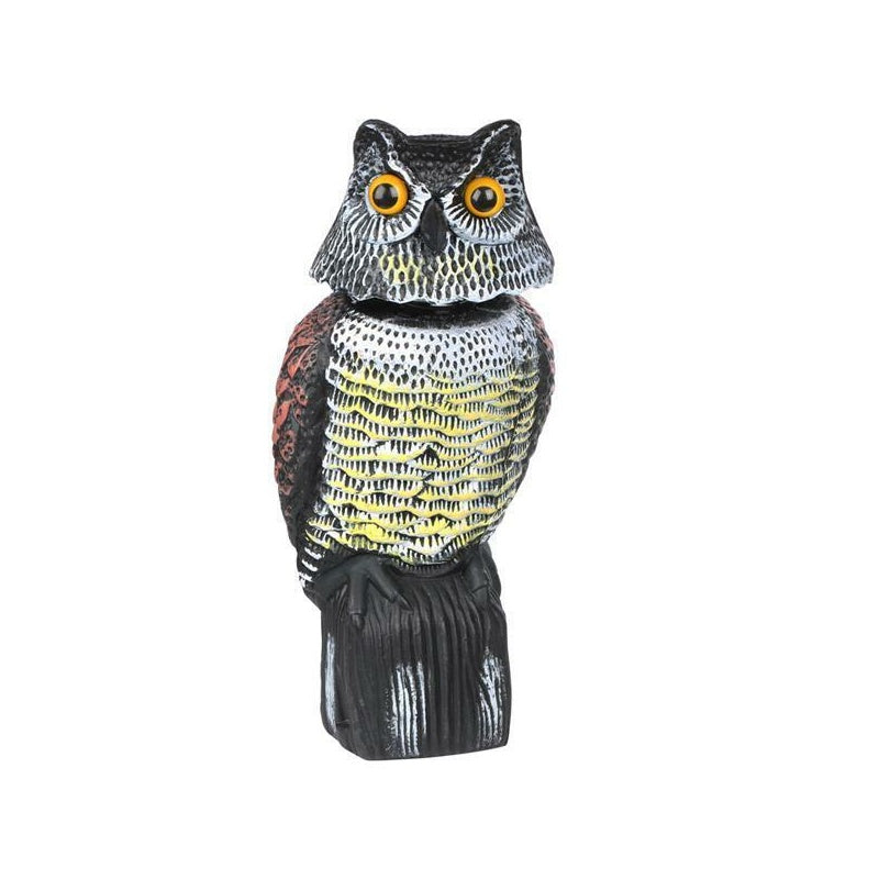 Owl decoy bird scarer showing moveable head in garden