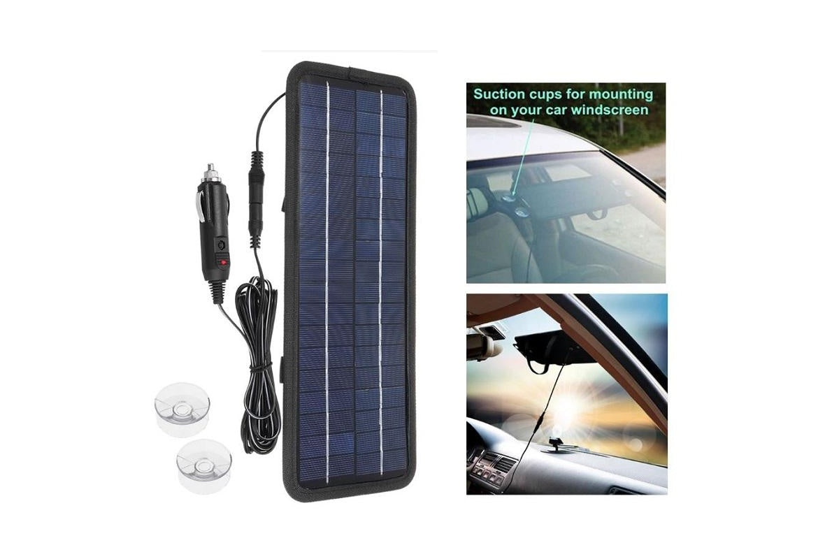Close-up of solar car battery charger 12V with suction cups attached