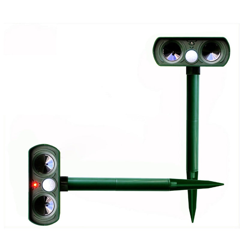 Ultrasonic animal repeller showing green waterproof casing