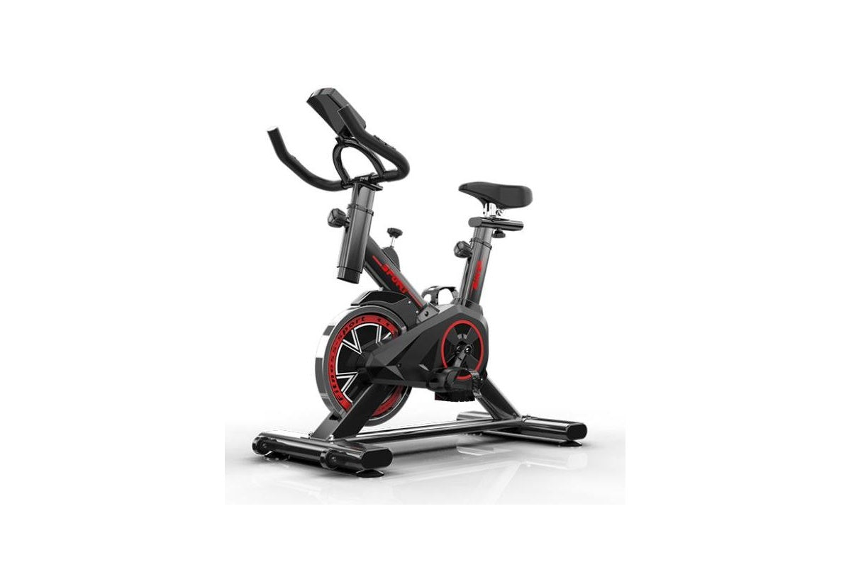 Close up of exercise bike black steel frame and pedals