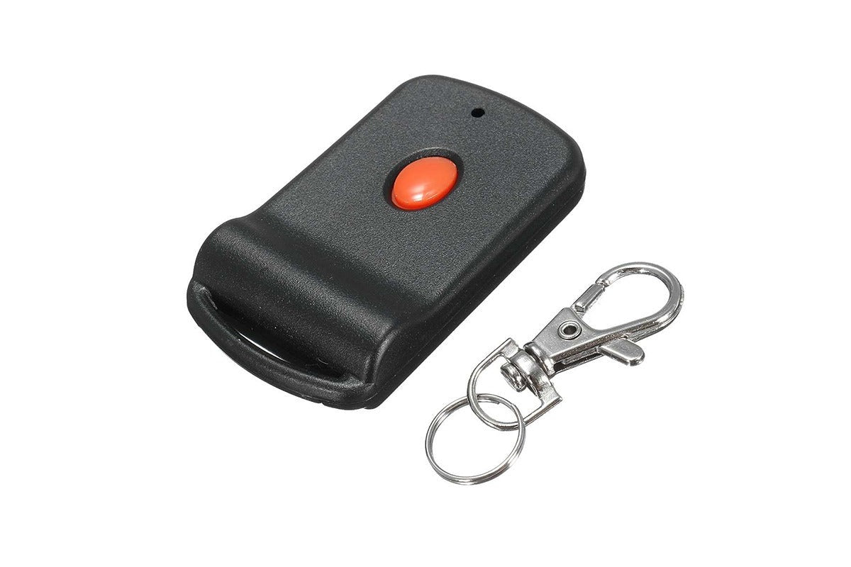 Close up of Tiltamatic garage remote red button detail