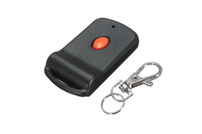 Close up of Tiltamatic garage remote red button detail