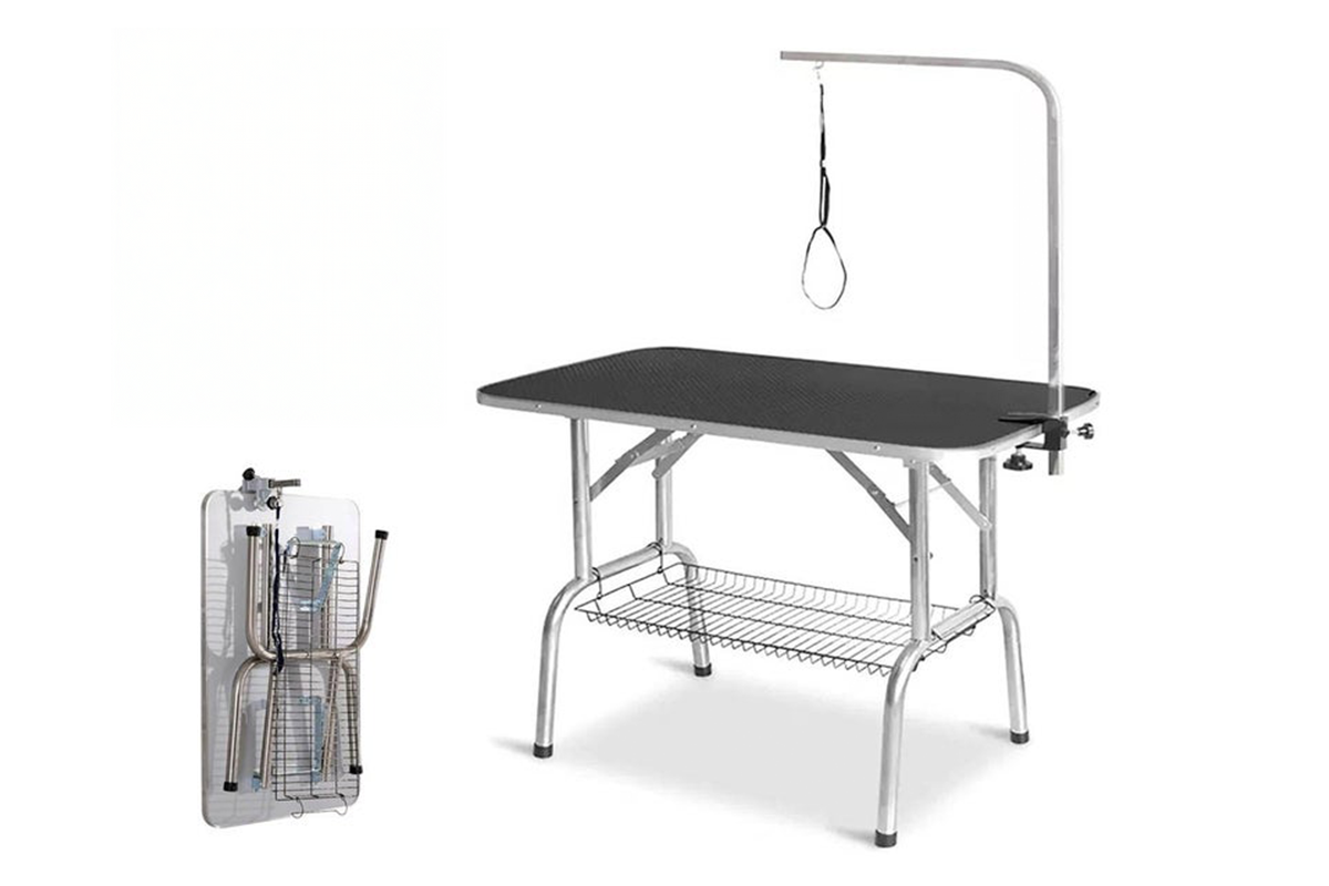 Side view of pet grooming table with adjustable arm