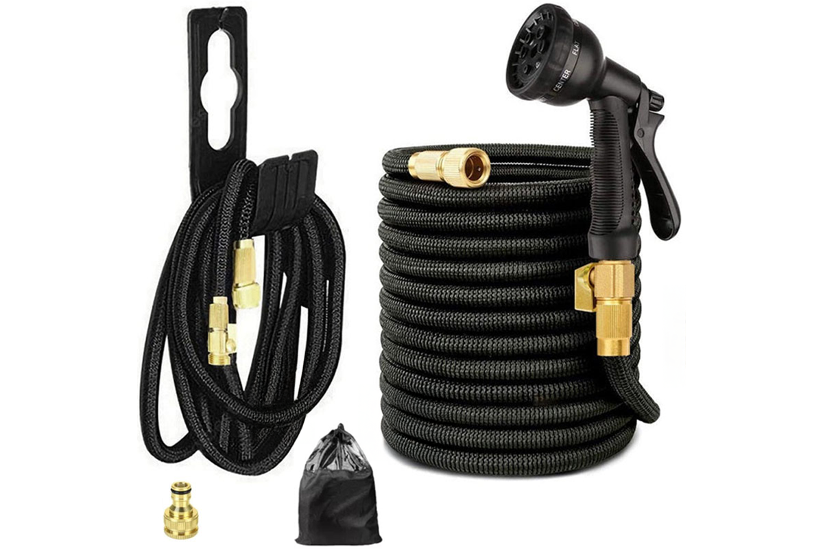 Close up of brass connector on expandable flexible garden hose