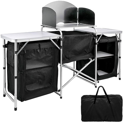 Camping kitchen showing aluminium tabletops and storage cupboards