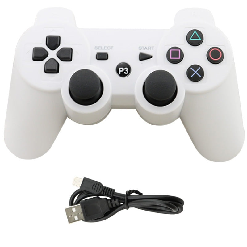 Wireless PS3 controller showing front buttons and ergonomic grip