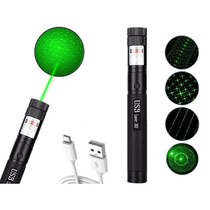 Green laser pointer pen showing bright beam in dark room
