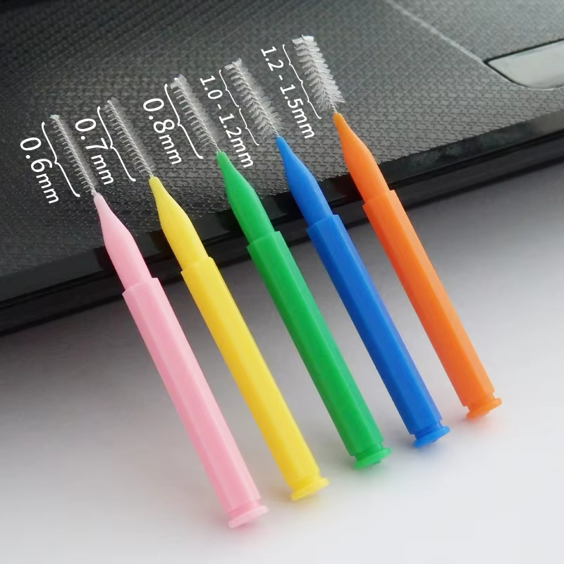 Interdental brush toothpick showing flexible bristles and wire core