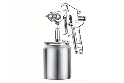 Close up of stainless steel nozzle on airless paint sprayer