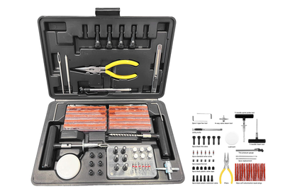 Close-up of tyre repair kit tools in black case