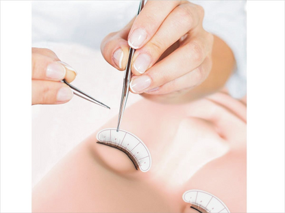 Lash extensions kit tape roll and tweezers in use setup