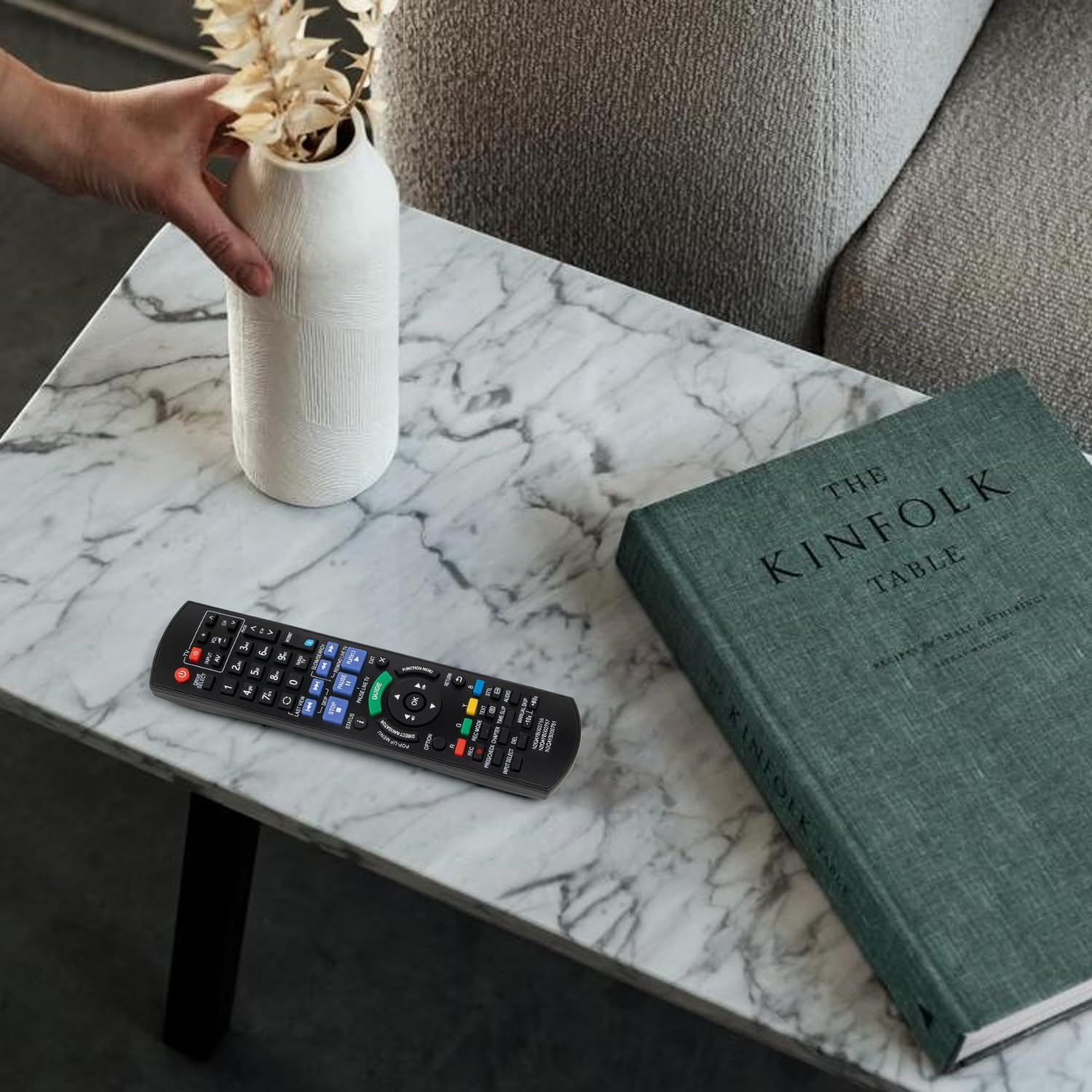 Replacement remote for Panasonic Blu-ray disc resting on wooden table