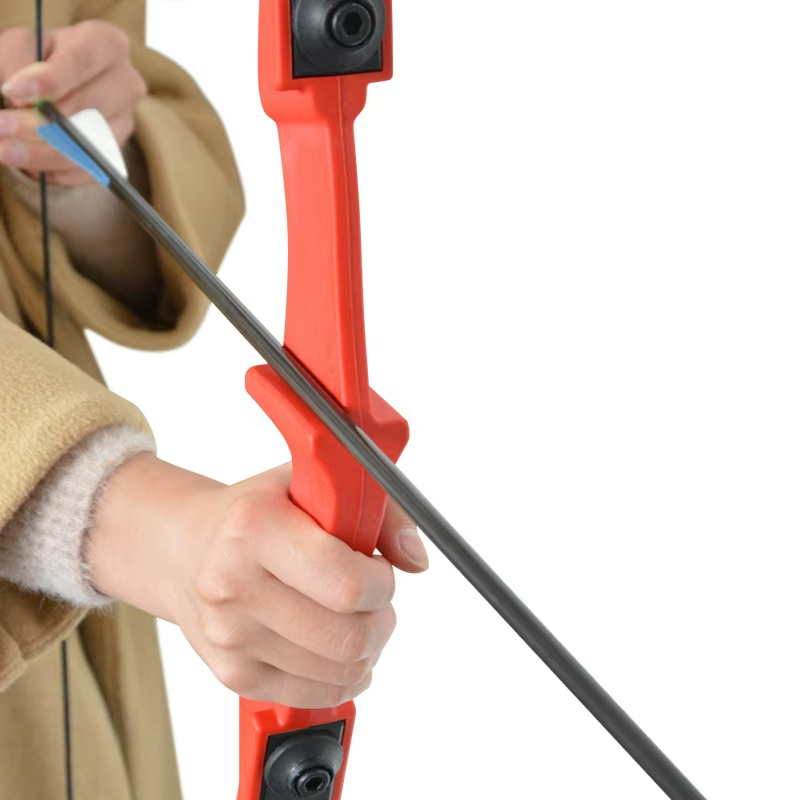 Hunting archery bow resting on grass for outdoor use