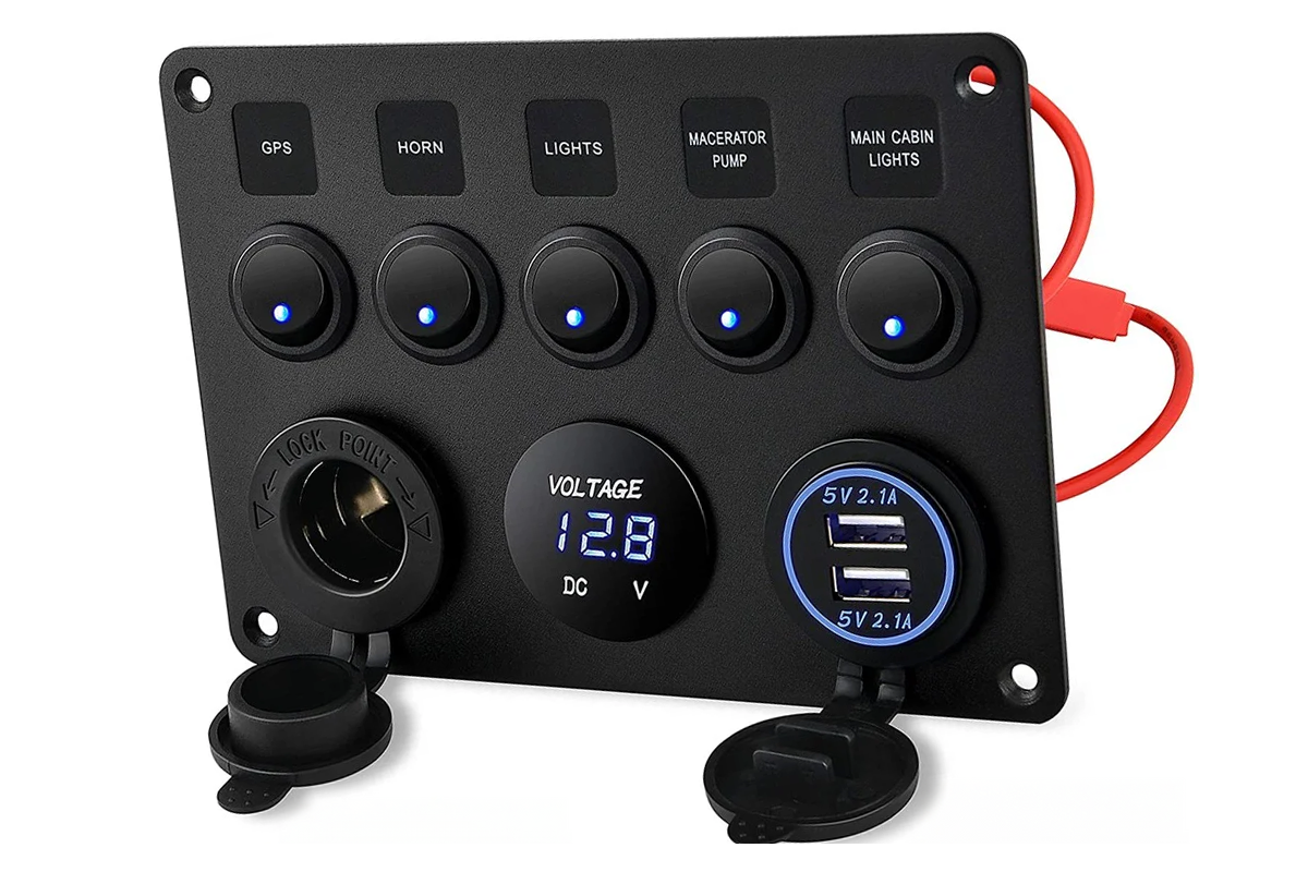 Close-up of rocker switch panel USB ports in black aluminium