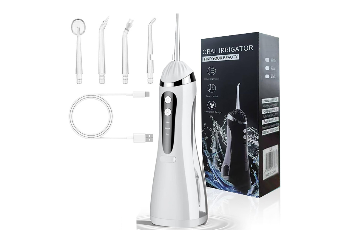 Close up of water flosser cordless oral irrigator nozzle tip for precise cleaning