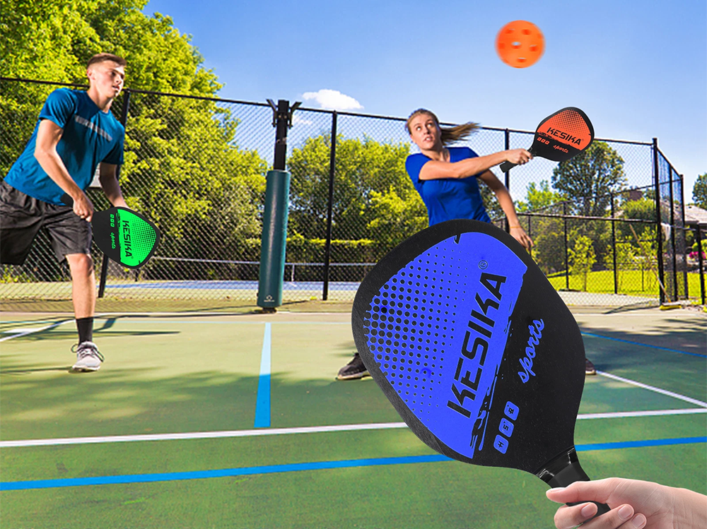 Four aerodynamic pickleballs included in the set on a white background