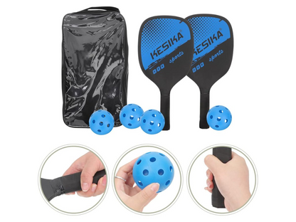 Pickleball set paddles and balls displayed on indoor court surface