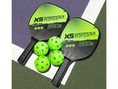 Pickleball set displayed with paddles crossed and balls in front