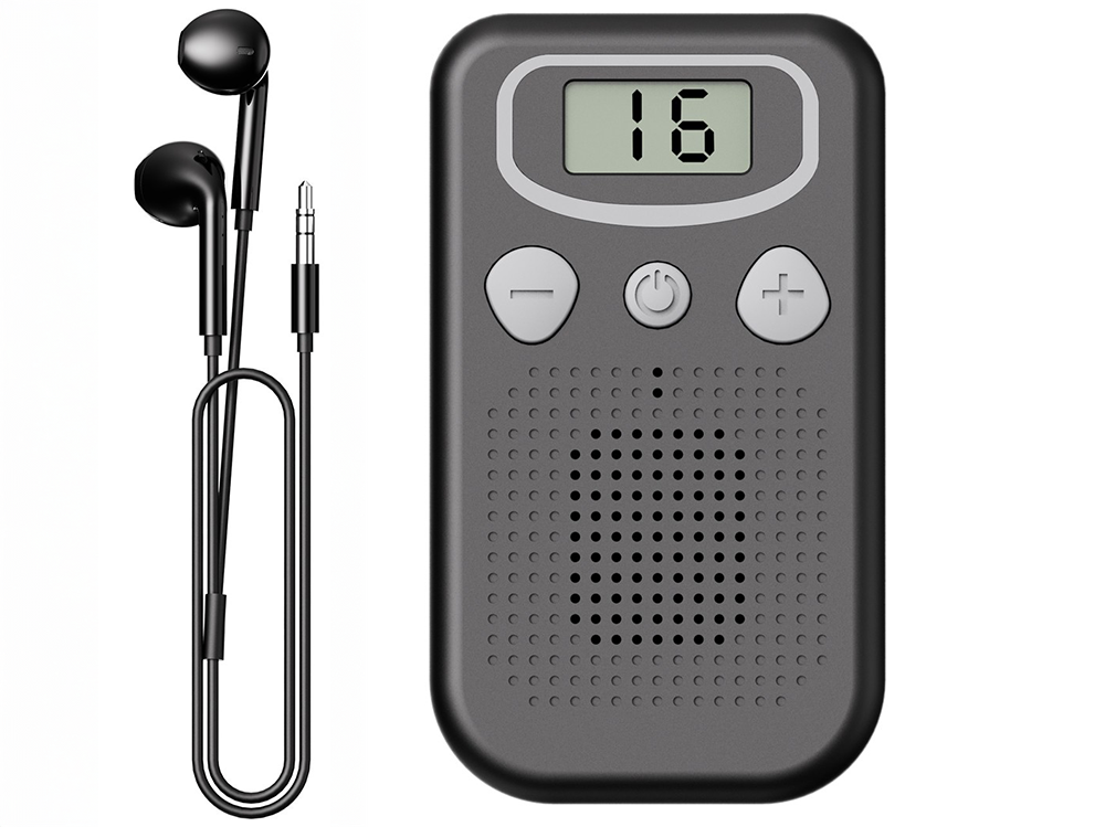 Close-up of digital LCD display on ear hearing aids device