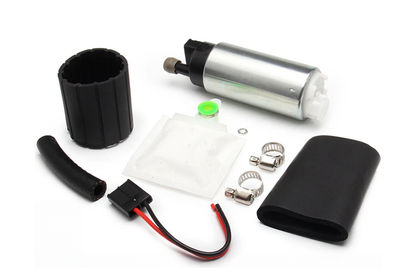Close up of electric fuel pump 12V kit inlet and outlet ports