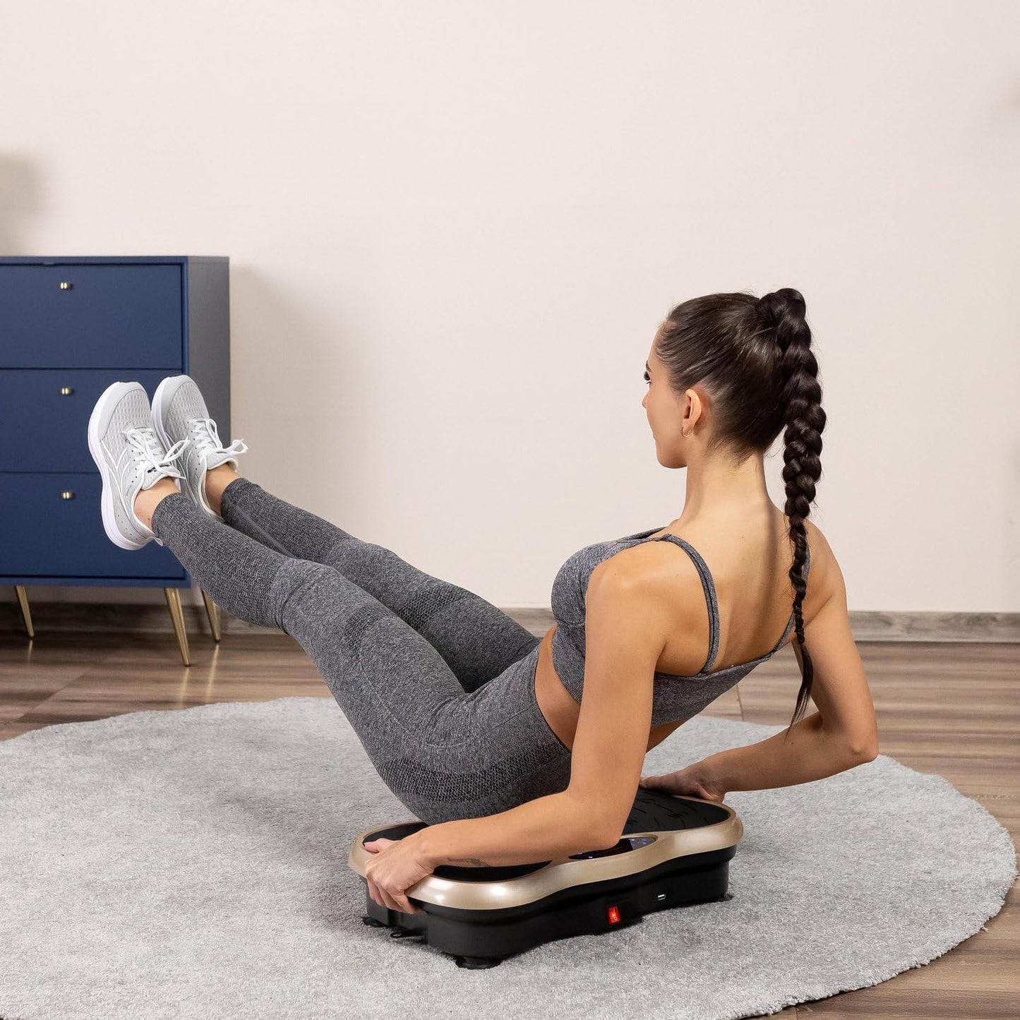 Vibration plate exercise machine with yoga straps attached