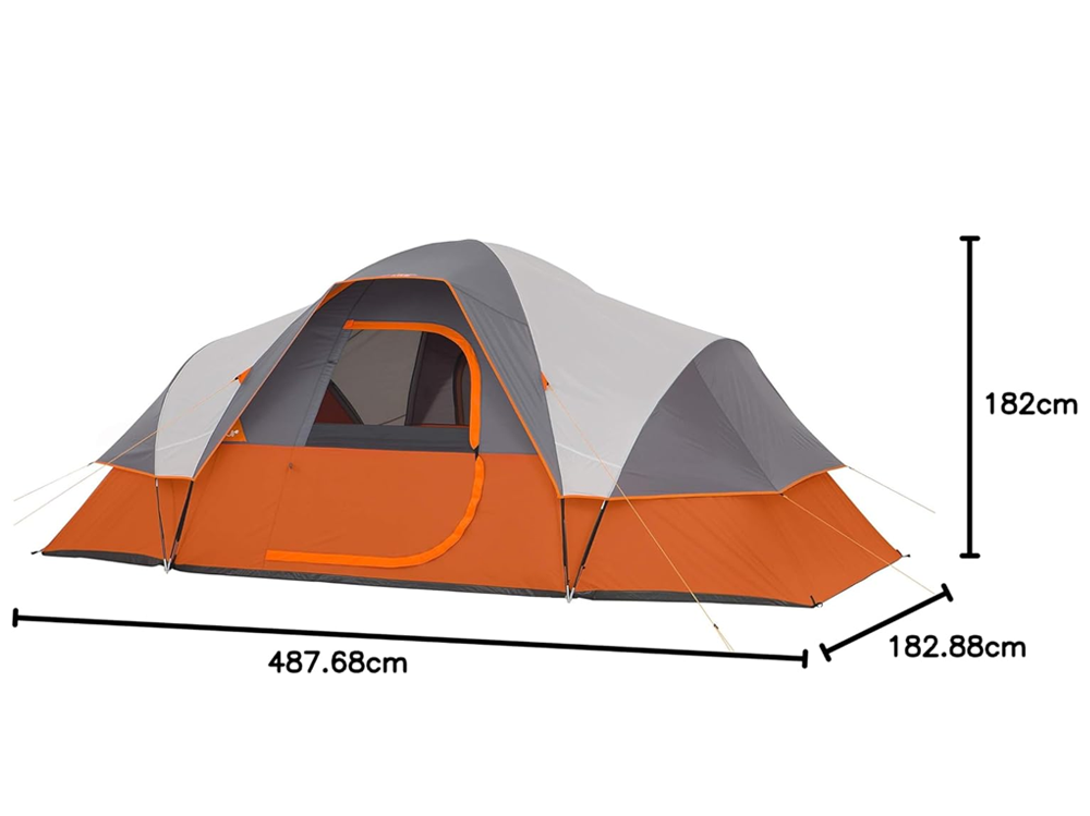 Camping tent family tent pitched on grass with orange fabric