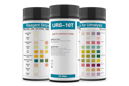 Close up of urine PH test strip tip with colour comparison chart