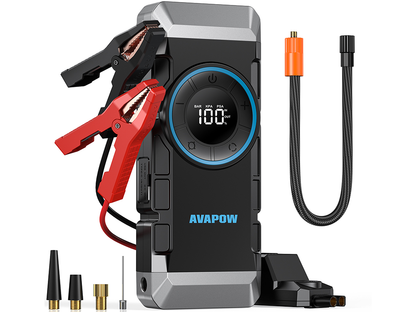 Car jump starter with air compressor used outdoors at night with LED light