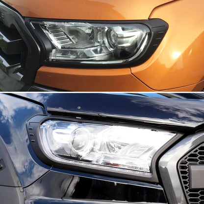 Pair of headlight and tail light covers displayed on bench