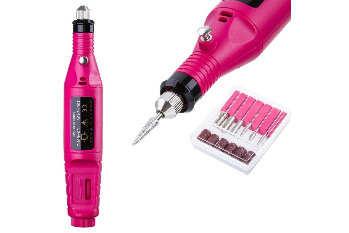 Close up of electric nail drill handpiece with sanding band