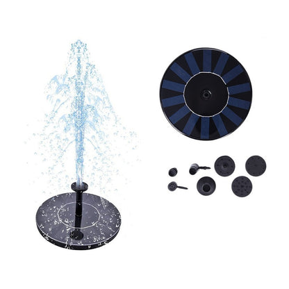 Solar water fountain floating on pond with solar panel