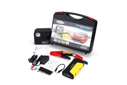 Close up of car jump starter battery clamps and air compressor nozzle