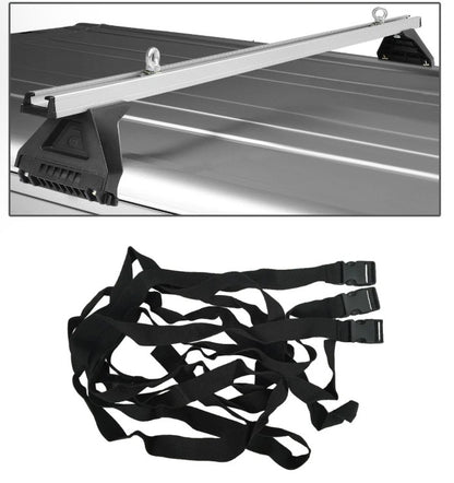 Tie-down straps attached to car roof rack cross bar for load security