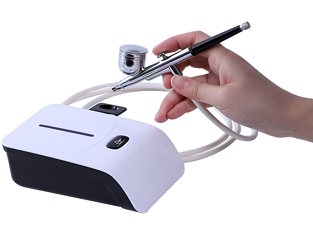 Air brush compressor kit with power adapter and rubber hose