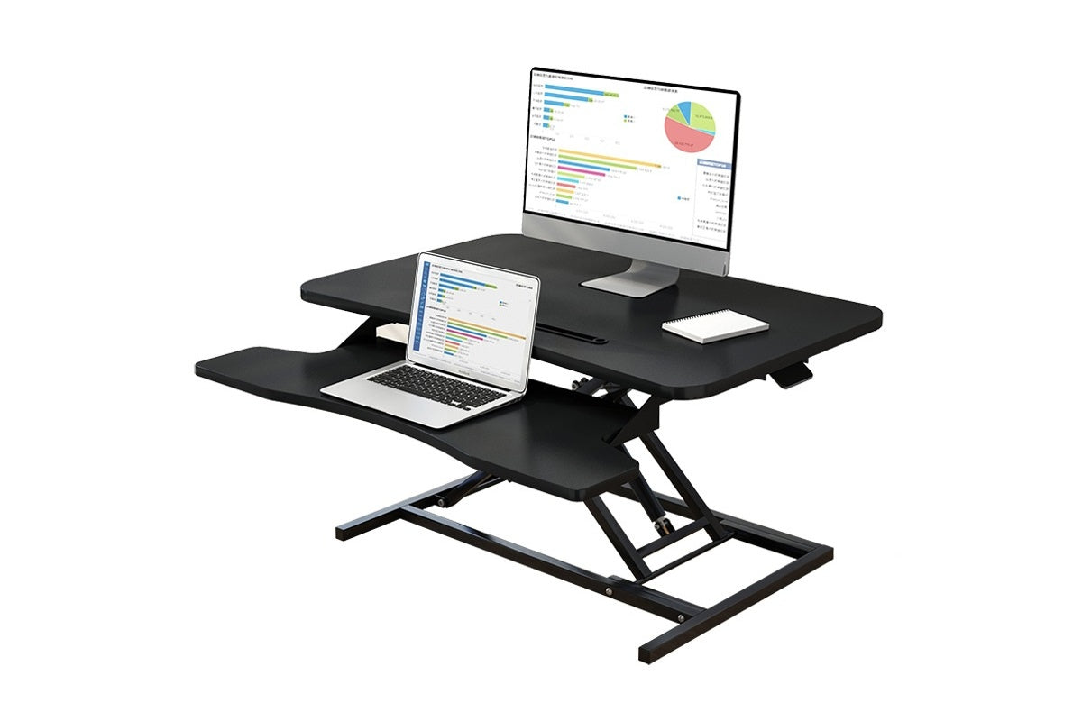 Side view of height adjustable computer desk table showing gas spring lift
