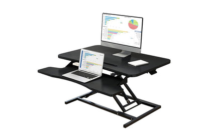 Side view of height adjustable computer desk table showing gas spring lift