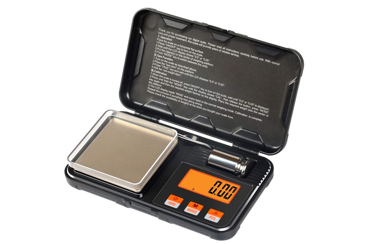 Pocket size digital scale with LCD display turned on