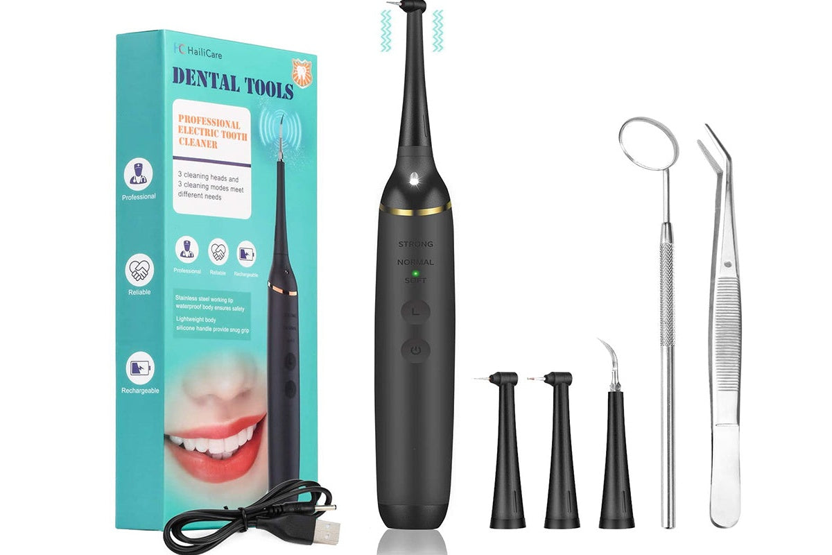 Close up of electric dental calculus remover metal cleaning head