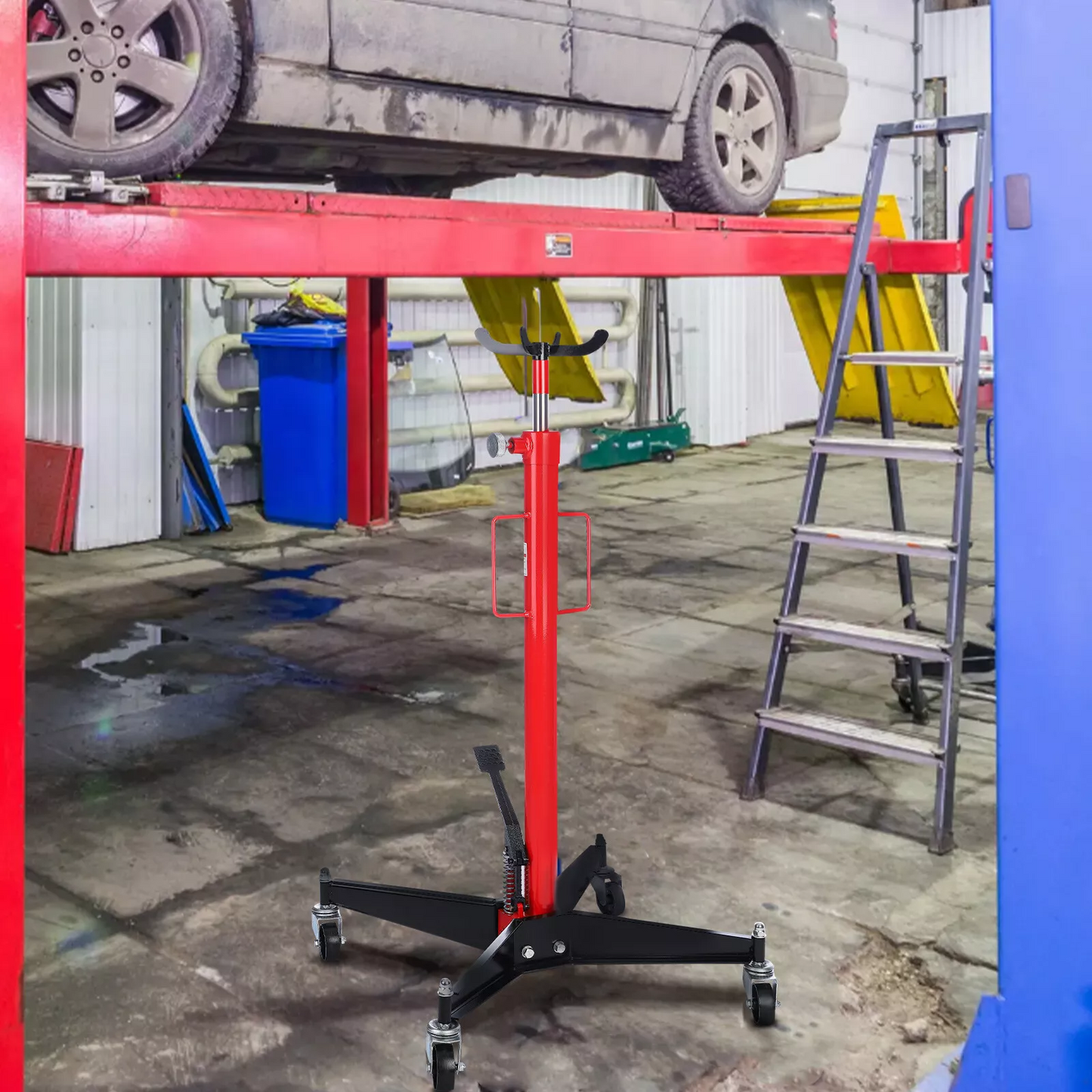 Transmission jack lifting a vehicle component in workshop