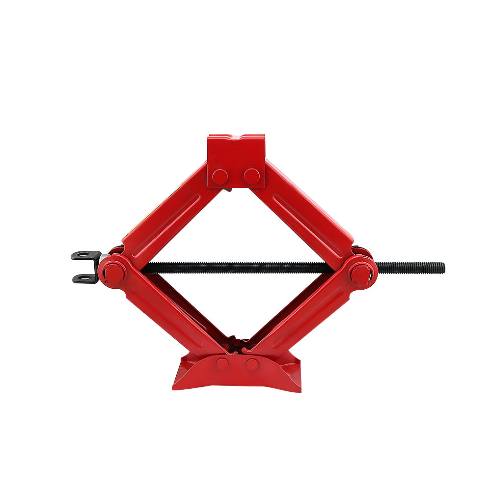 Heavy duty scissors jack placed on flat ground for stability