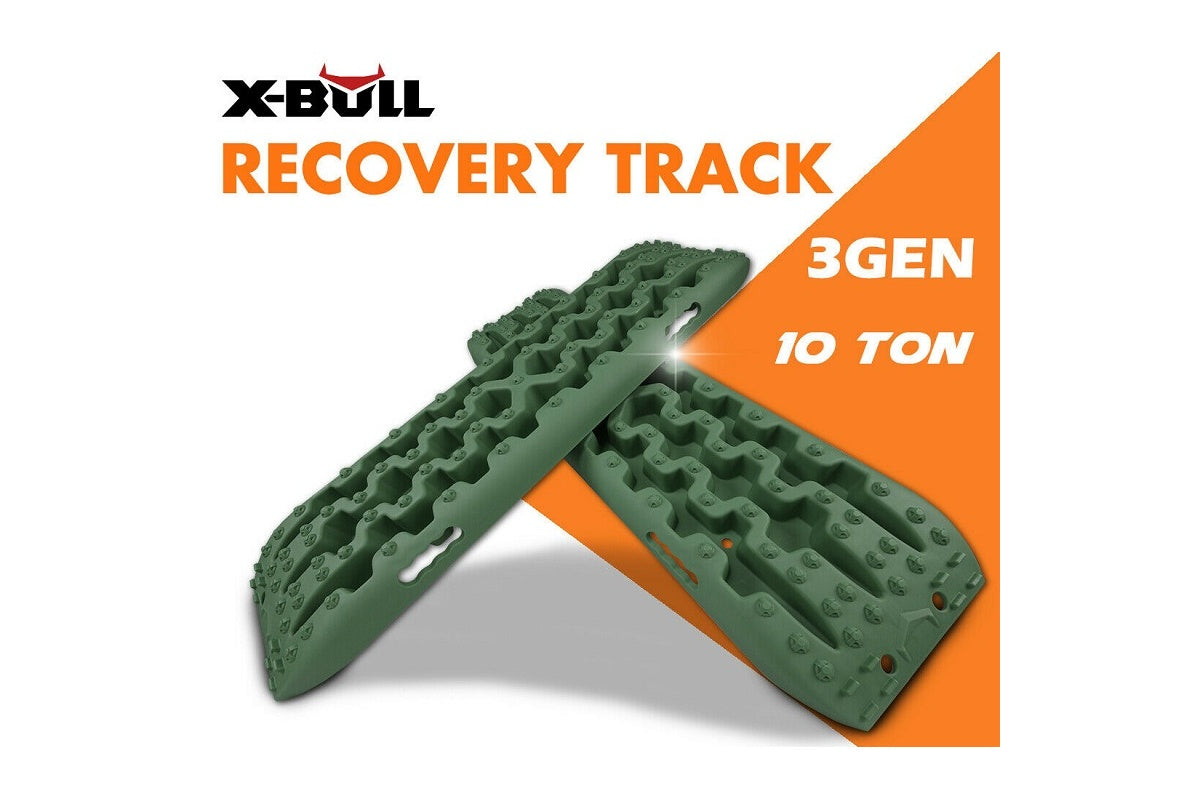 Recovery tracks positioned under 4WD tyre in mud