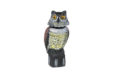 Close up of owl decoy bird scarer head detail