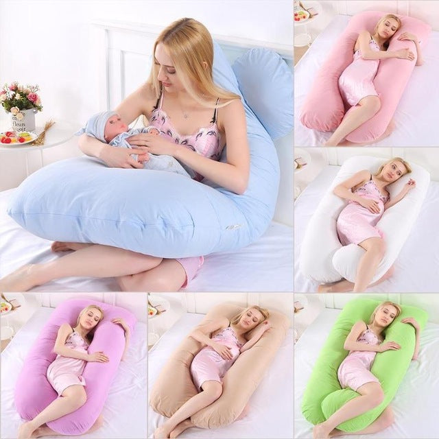 Pink pregnancy pillow supporting head and body
