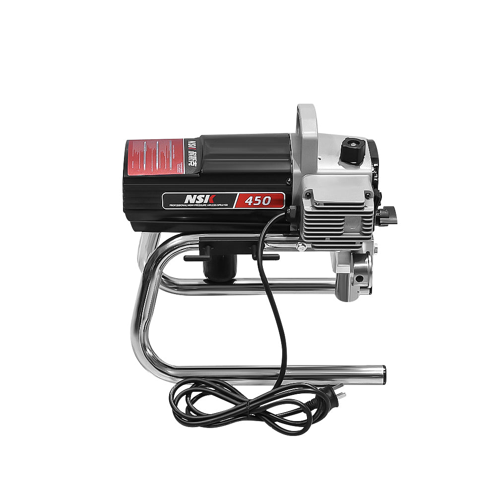 Airless paint sprayer spraying white paint on wall