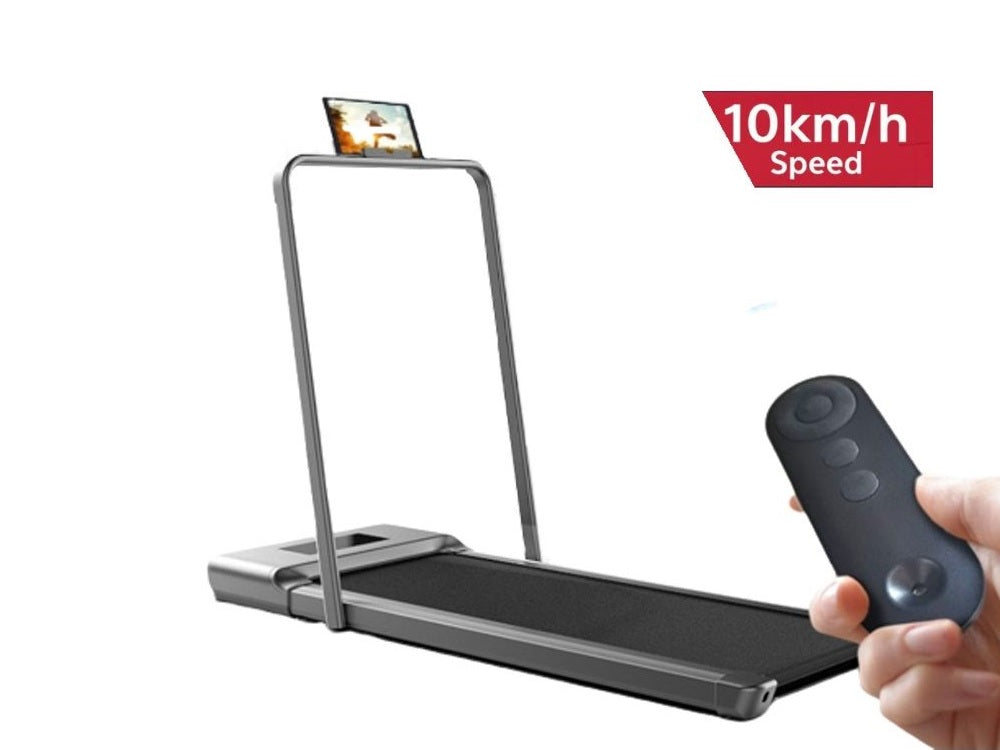 Foldable walking pad treadmill under a desk in a home office