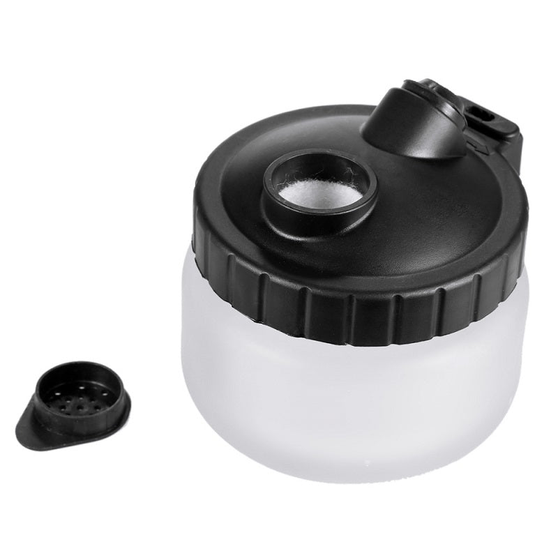 Close-up of metal carrying handle on airbrush cleaning pot